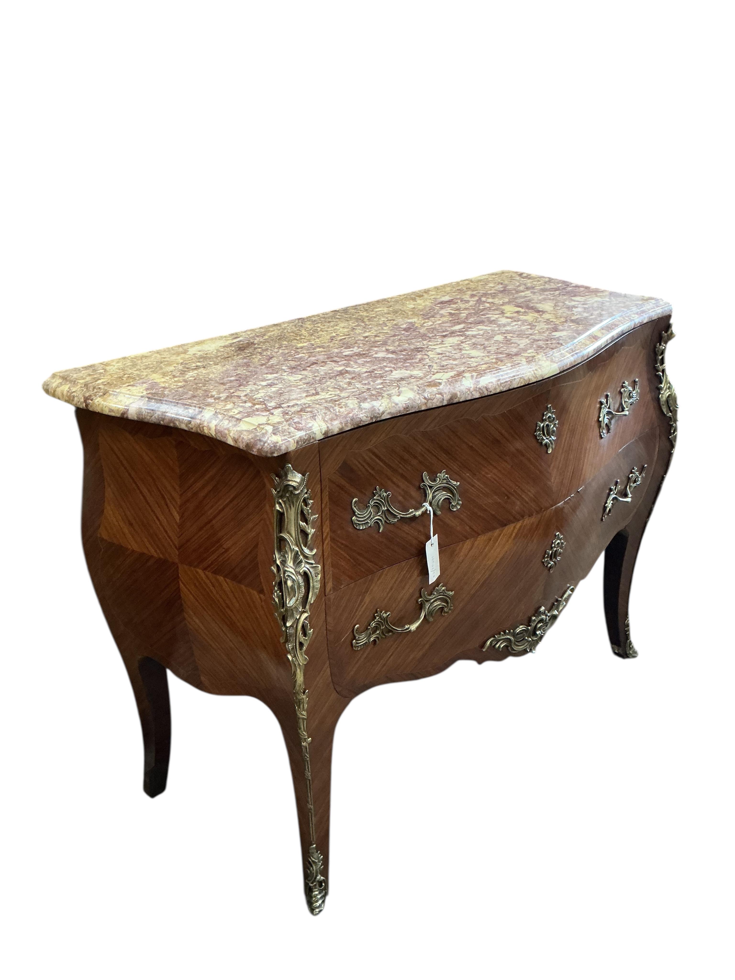 A Louis XV style gilt metal mounted marble top kingwood bombe commode, width 116cm, depth 53cm, height 86cm